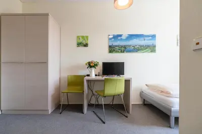 Ein Bett oder Betten in einem Zimmer der Unterkunft Hotel-Pension am Siegestor