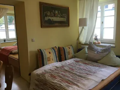 Ein Bett oder Betten in einem Zimmer der Unterkunft Am-Berg Ferienwohnung in Bad kohlgrub