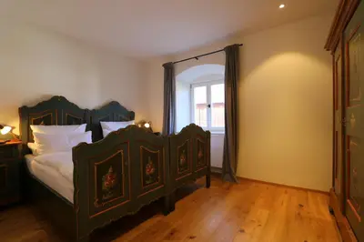 Ein Bett oder Betten in einem Zimmer der Unterkunft Ferienwohnungen im Gasthof Stern inklusive KönigsCard