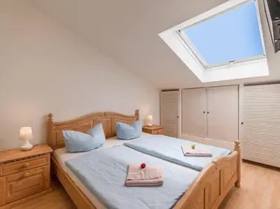 Ein Bett oder Betten in einem Zimmer der Unterkunft Bergschlössl - Appartment 25 mit Traumblick über das Inntal
