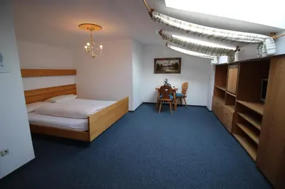 Ein Bett oder Betten in einem Zimmer der Unterkunft Erlebnislandgasthof Hotel Neiderhell