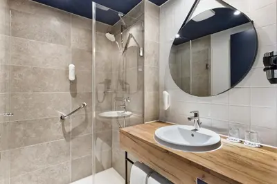 Ein Badezimmer in der Unterkunft H2 Hotel München Olympiapark