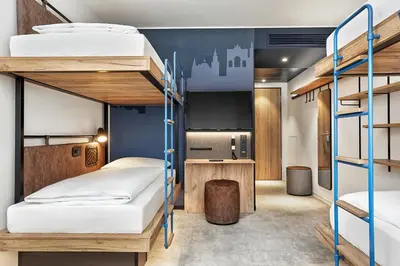 Ein Bett oder Betten in einem Zimmer der Unterkunft H2 Hotel München Olympiapark