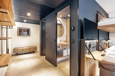 Ein Bett oder Betten in einem Zimmer der Unterkunft H2 Hotel München Olympiapark