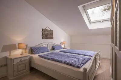Ein Bett oder Betten in einem Zimmer der Unterkunft Bergschlössl - Massionettwohnung 13
