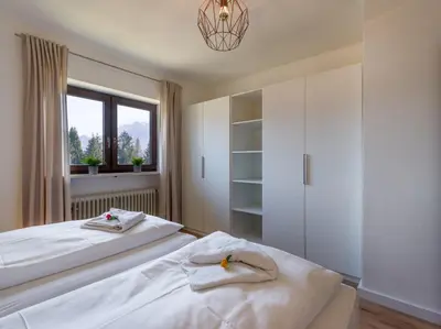 Ein Bett oder Betten in einem Zimmer der Unterkunft Zahmer Kaiser