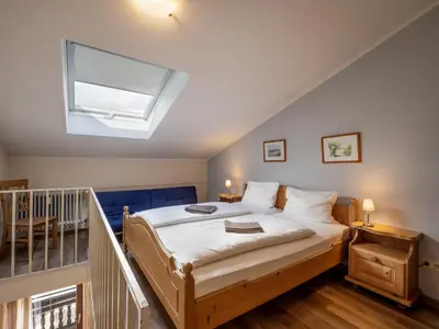 Ein Bett oder Betten in einem Zimmer der Unterkunft Bergschlössl - Massionettwohnung 22