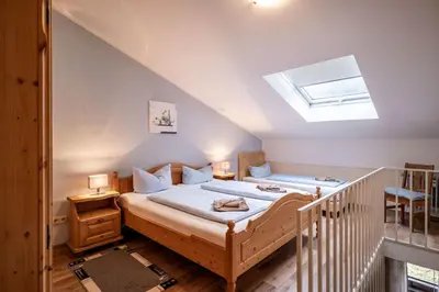 Ein Bett oder Betten in einem Zimmer der Unterkunft Bergschlössl - Massionettwohnung 16