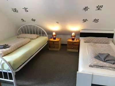 Ein Bett oder Betten in einem Zimmer der Unterkunft Ferienwohnung Aretsried 2