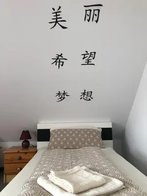 Ein Bett oder Betten in einem Zimmer der Unterkunft Ferienwohnung Aretsried 2
