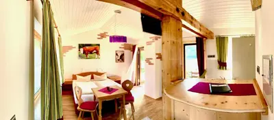 Ein Bett oder Betten in einem Zimmer der Unterkunft Appartementhaus „die Kuh am See“ (vormals Haus St. Leonhard)