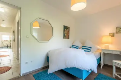 Ein Bett oder Betten in einem Zimmer der Unterkunft DARFATI 4-Zimmer Wohnung