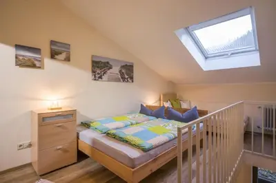 Ein Bett oder Betten in einem Zimmer der Unterkunft Bergschlössl - Maissonettwohnung 15