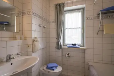 Ein Badezimmer in der Unterkunft Ferienwohnanlage Brünnstein Kaiserhimmel mit Schwimmbad und Sauna