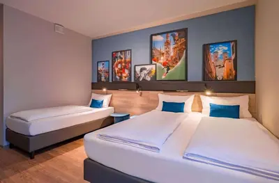 Ein Bett oder Betten in einem Zimmer der Unterkunft Ramada Encore by Wyndham Munich Messe