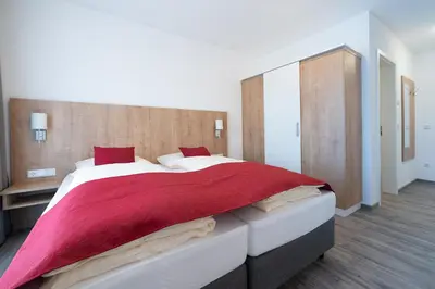 Ein Bett oder Betten in einem Zimmer der Unterkunft Boardinghaus Bayerwaldpark