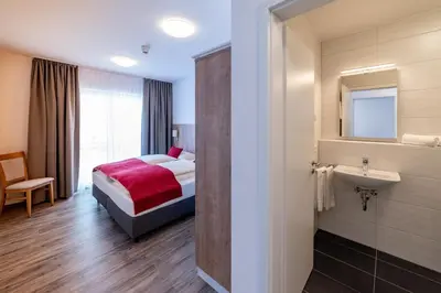Ein Bett oder Betten in einem Zimmer der Unterkunft Boardinghaus Bayerwaldpark