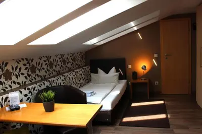Ein Bett oder Betten in einem Zimmer der Unterkunft greenpartment Ingolstadt - Friedrichshofen