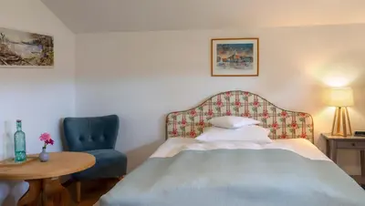 Ein Bett oder Betten in einem Zimmer der Unterkunft Hotel Ziegleder