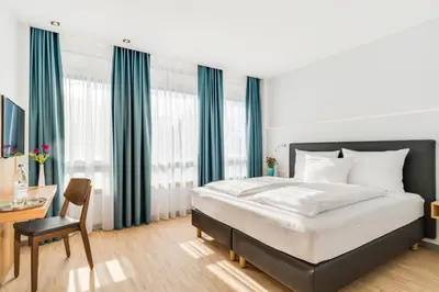 Ein Bett oder Betten in einem Zimmer der Unterkunft Hotel-Etage Apfelrot managed by Hotel Apfelbaum