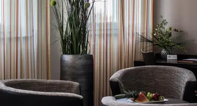 Ein Sitzbereich in der Unterkunft GS Hotel