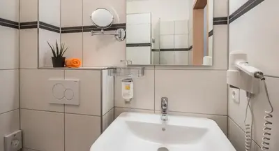 Ein Badezimmer in der Unterkunft GS Hotel