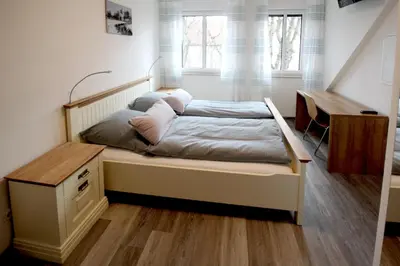Ein Bett oder Betten in einem Zimmer der Unterkunft Zur Friedenseiche
