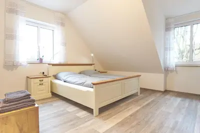 Ein Bett oder Betten in einem Zimmer der Unterkunft Zur Friedenseiche