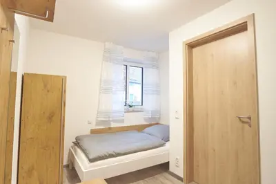 Ein Bett oder Betten in einem Zimmer der Unterkunft Zur Friedenseiche
