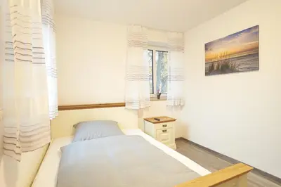 Ein Bett oder Betten in einem Zimmer der Unterkunft Zur Friedenseiche