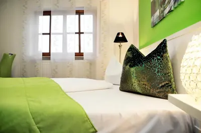 Ein Bett oder Betten in einem Zimmer der Unterkunft Hotel zum Brunnen