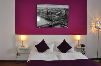 Ein Bett oder Betten in einem Zimmer der Unterkunft Hotel zum Brunnen