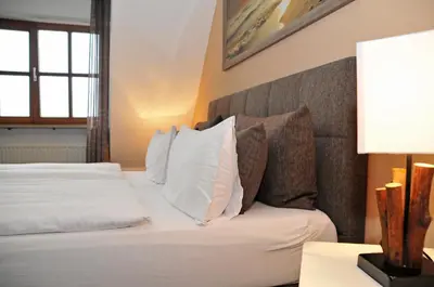 Ein Bett oder Betten in einem Zimmer der Unterkunft Hotel zum Brunnen