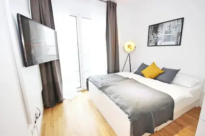 Ein Bett oder Betten in einem Zimmer der Unterkunft Apart Hotel Messe Munich - my room Apartments