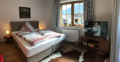 Ein Bett oder Betten in einem Zimmer der Unterkunft ALPENFREUND
