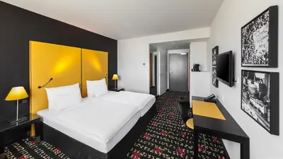 Ein Bett oder Betten in einem Zimmer der Unterkunft Holiday Inn Munich - Westpark by IHG