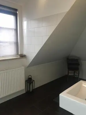 Ein Bett oder Betten in einem Zimmer der Unterkunft Helle und ruhige Dachgeschosswohnung