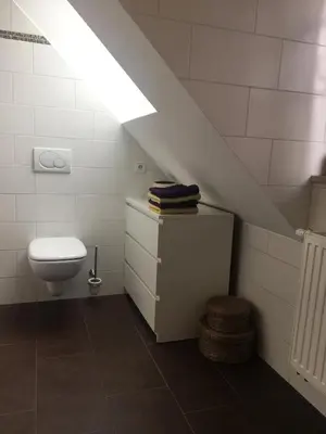 Ein Badezimmer in der Unterkunft Helle und ruhige Dachgeschosswohnung