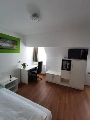 Ein Bett oder Betten in einem Zimmer der Unterkunft Hotel Alte Post