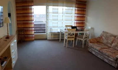 Ein Sitzbereich in der Unterkunft Sunny 1-room apartment near railway station