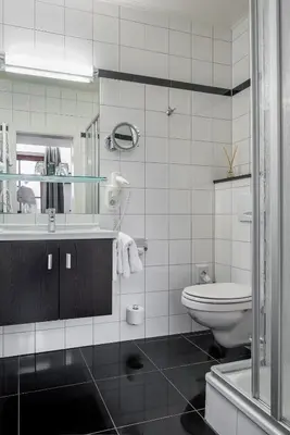 Ein Badezimmer in der Unterkunft Hotel Neuer am See
