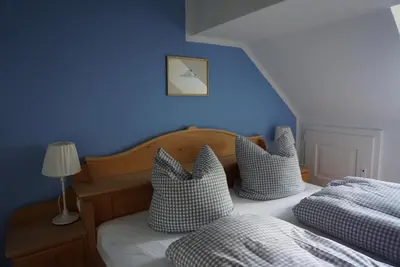 Ein Bett oder Betten in einem Zimmer der Unterkunft Gasthaus Fischerrosl