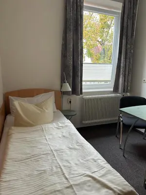 Ein Bett oder Betten in einem Zimmer der Unterkunft Gasthof Kreisi