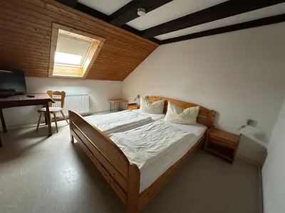 Ein Bett oder Betten in einem Zimmer der Unterkunft Gasthof Kreisi