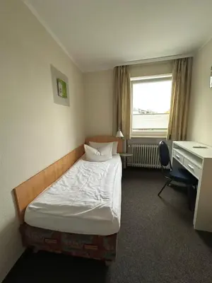 Ein Bett oder Betten in einem Zimmer der Unterkunft Gasthof Kreisi