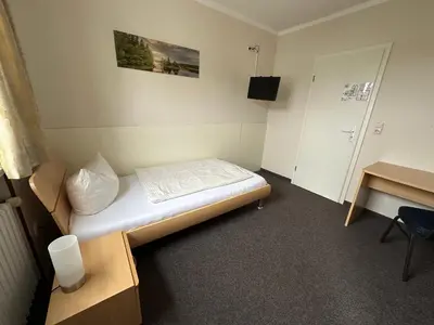 Ein Bett oder Betten in einem Zimmer der Unterkunft Gasthof Kreisi