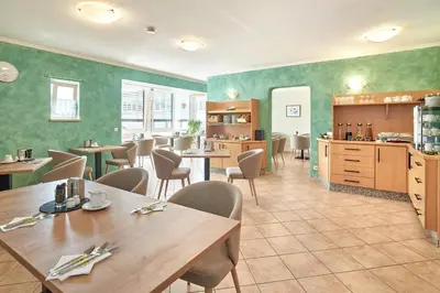 Ein Restaurant oder anderes Speiselokal in der Unterkunft Apparthotel Minerva Diana Octavia