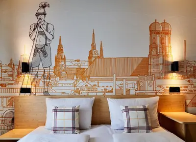 Ein Bett oder Betten in einem Zimmer der Unterkunft McDreams Hotel München - Messe