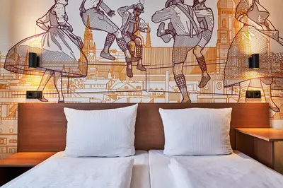 Ein Bett oder Betten in einem Zimmer der Unterkunft McDreams Hotel München - Messe
