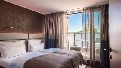 Ein Bett oder Betten in einem Zimmer der Unterkunft Innspire Hotel